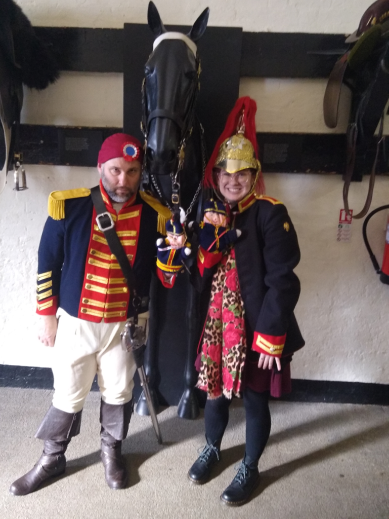Image of Volunteer, Amber Hederer at the Household Cavalry Museum with Robert Adams actor.
